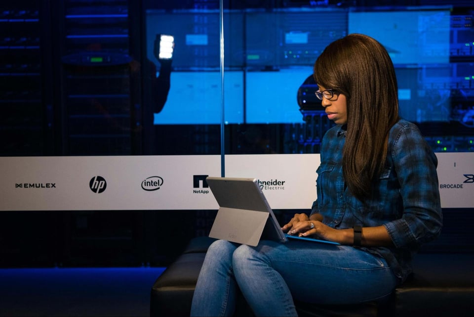 Woman using a tablet while sitting